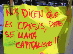 Pancarta 15-M "Nos dicen que es crisis, pero se llama capitalismo"